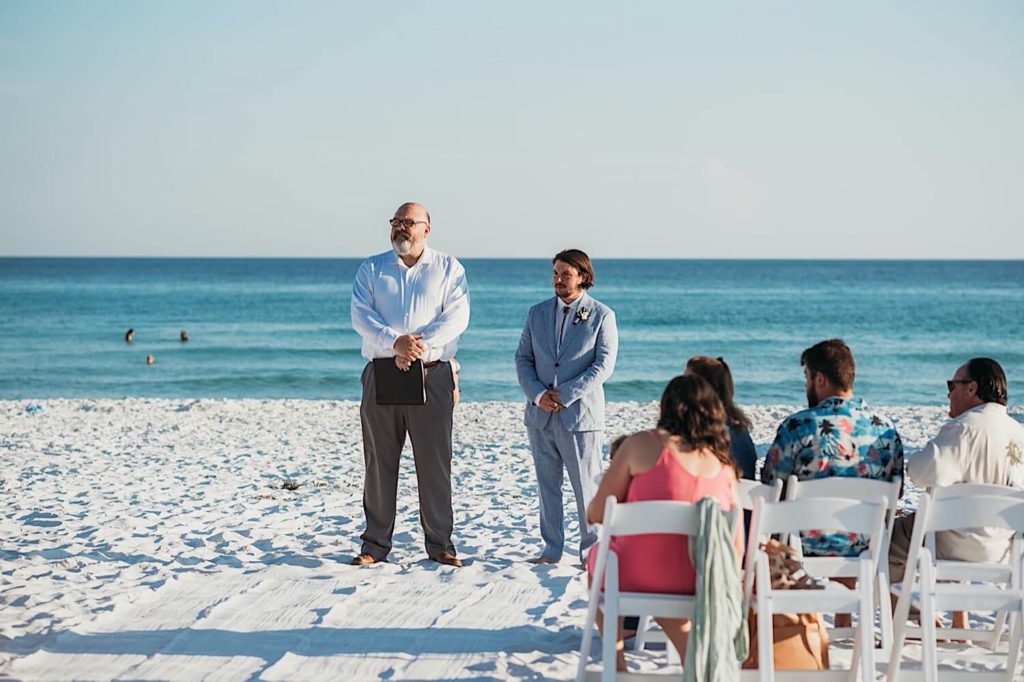 Groom waiting for his bride on the beach