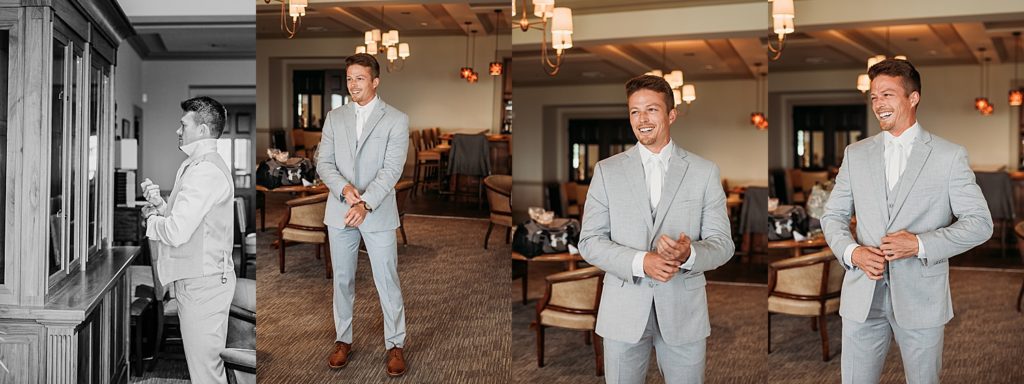 groom putting on grey suit before wedding ceremony at the Pensacola country club