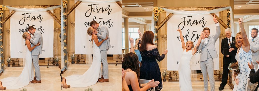 newly married couple share first kiss in front of Destin wedding photographer and family 