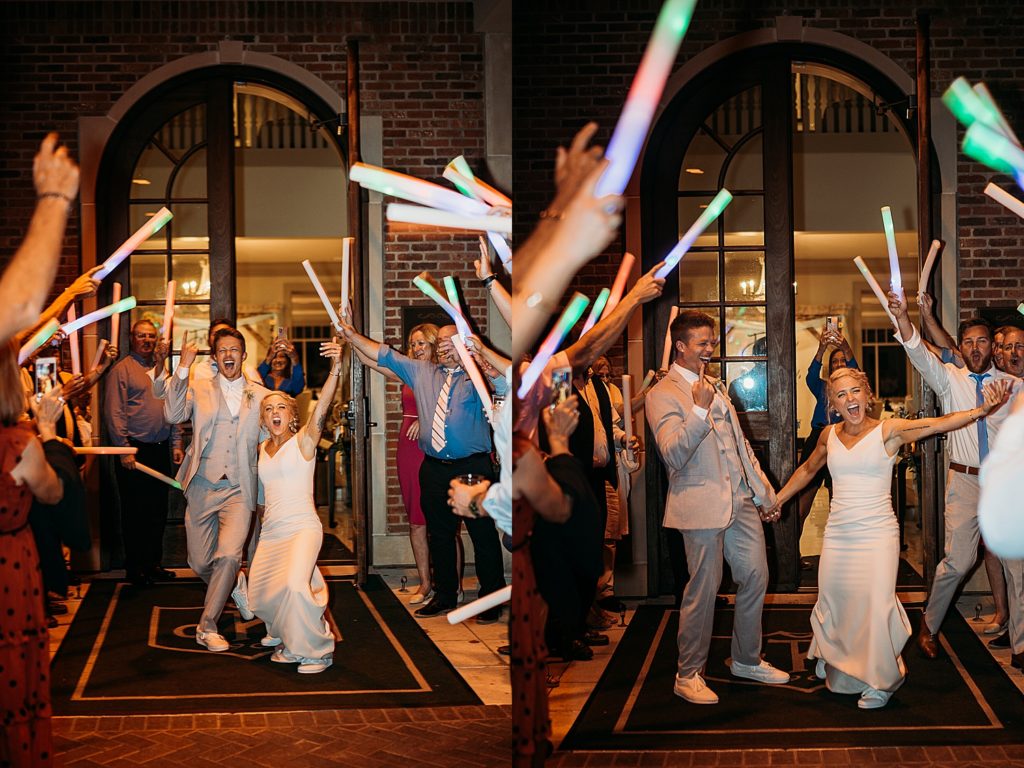 bride and groom have grand exit with friends and family cheering them out of their wedding venue 