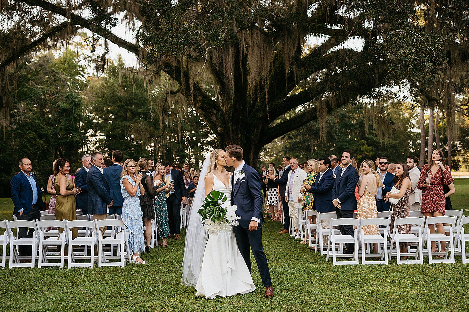 Bride and groom walk back up the aisle after ceremony during destination wedding 