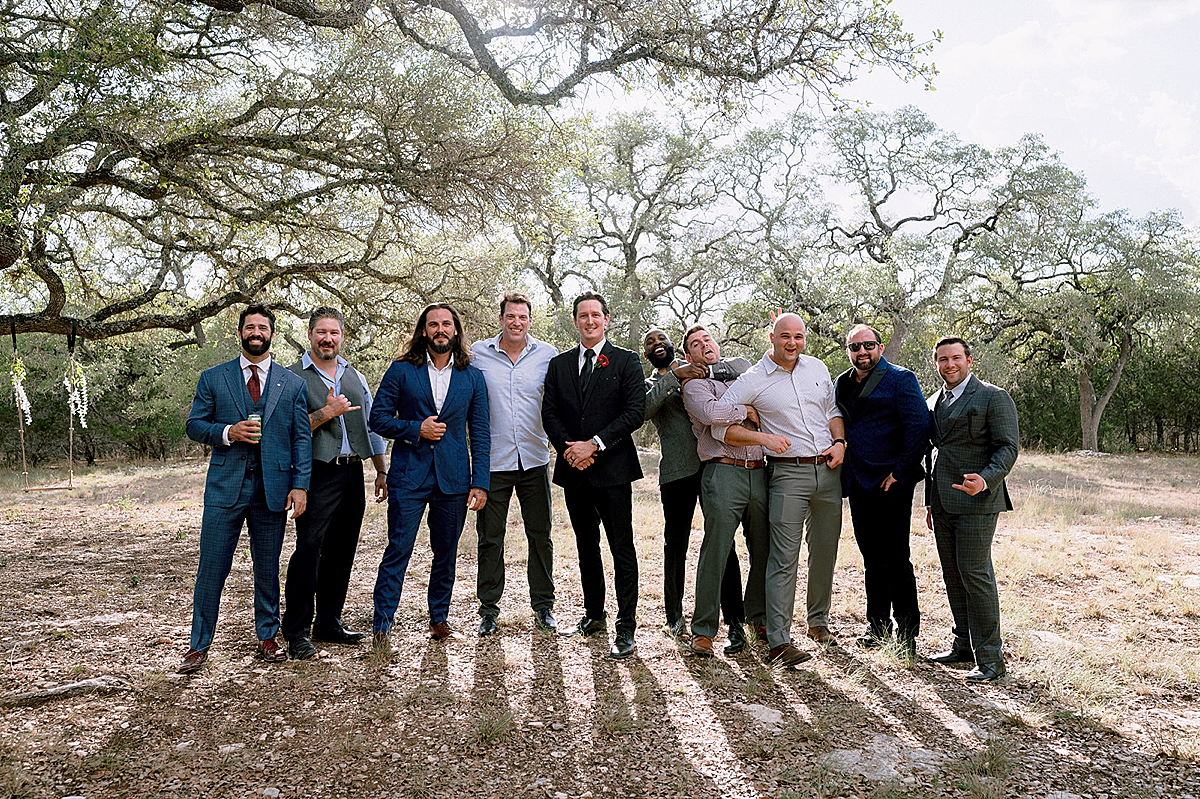 groom and friends in dress pants after outdoor ceremony at prima vista 