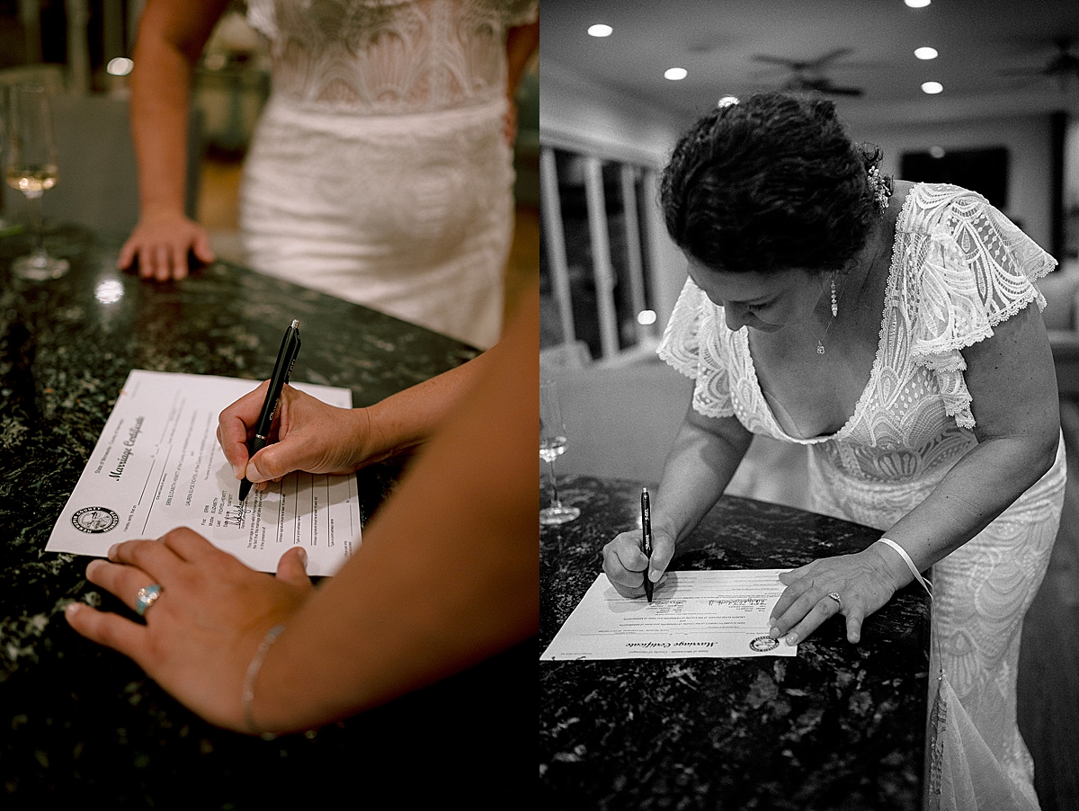 Brides signing marriage license at wedding reception for Destin Micro wedding