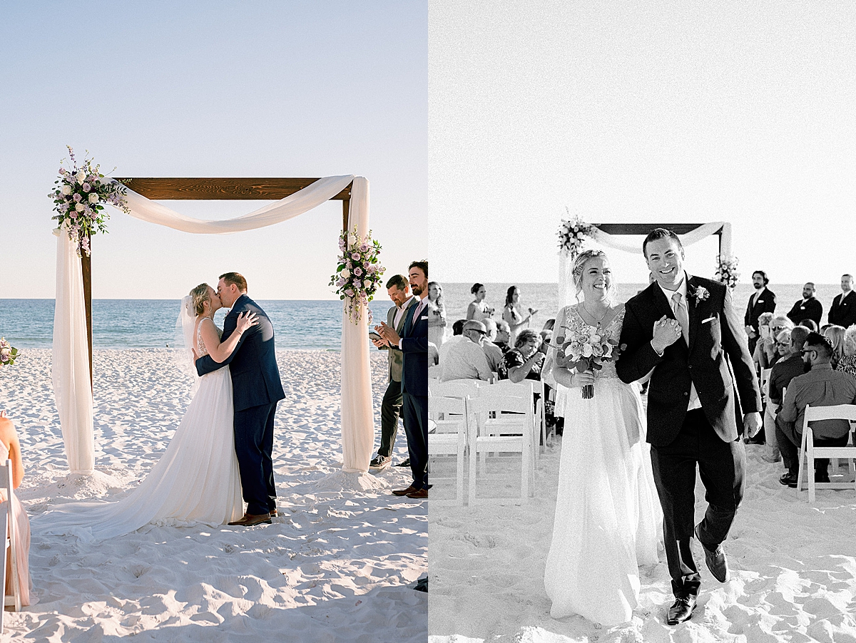 bride and groom share first kiss at the end of the aisle with arch by destination wedding photographer 