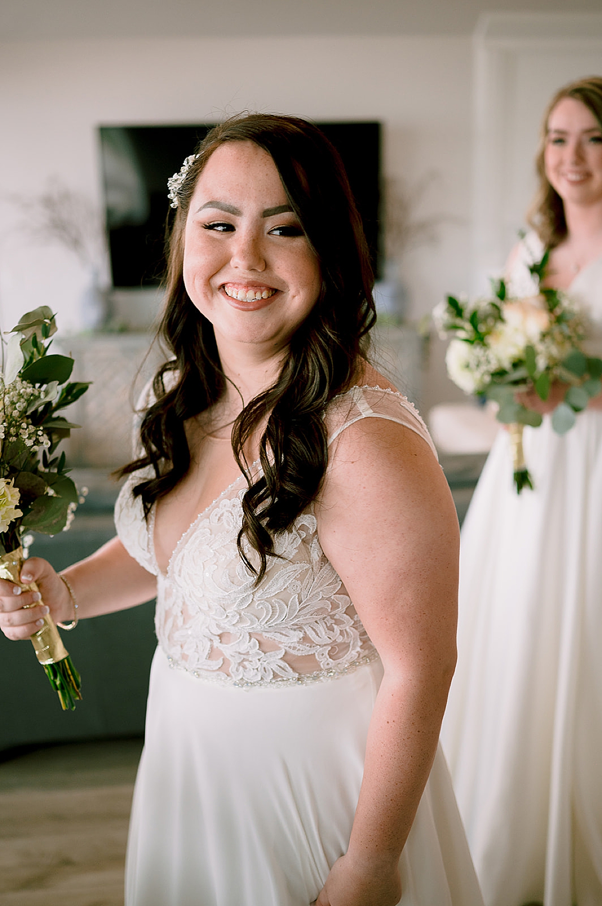 bride after getting ready with curly down hair and holding wedding florals  by 30A elopement photographer 